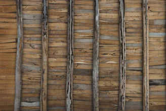 Photo of a rustic accent wall made from reclaimed wood planks.
