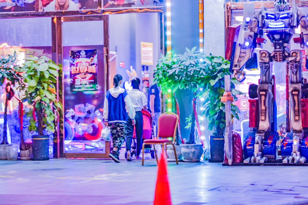 a group of people standing in front of a store