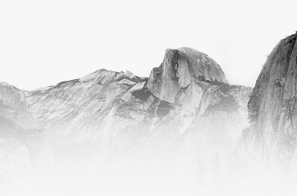 a black and white photo of a mountain range