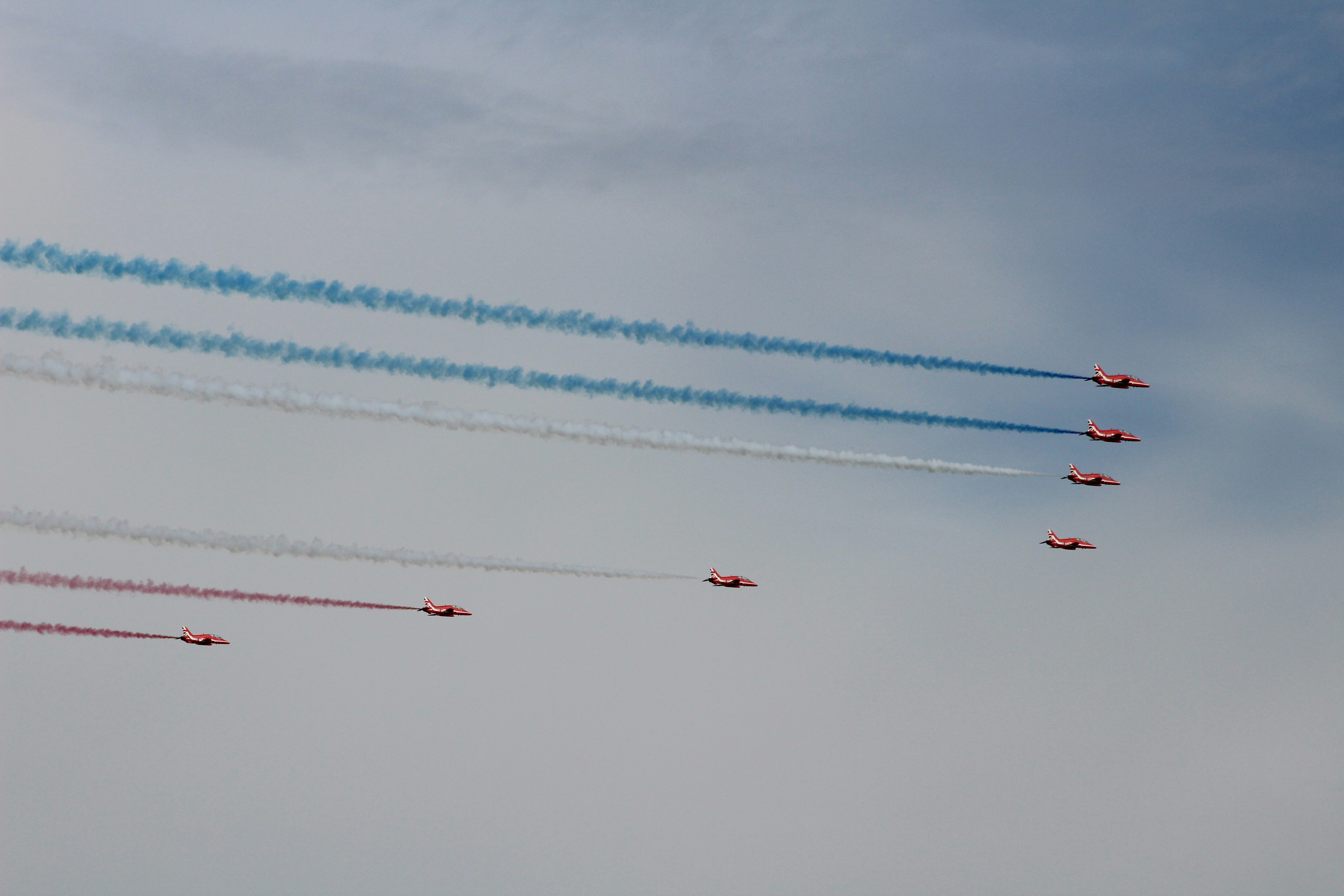 a group of airplanes flying in formation in the sky