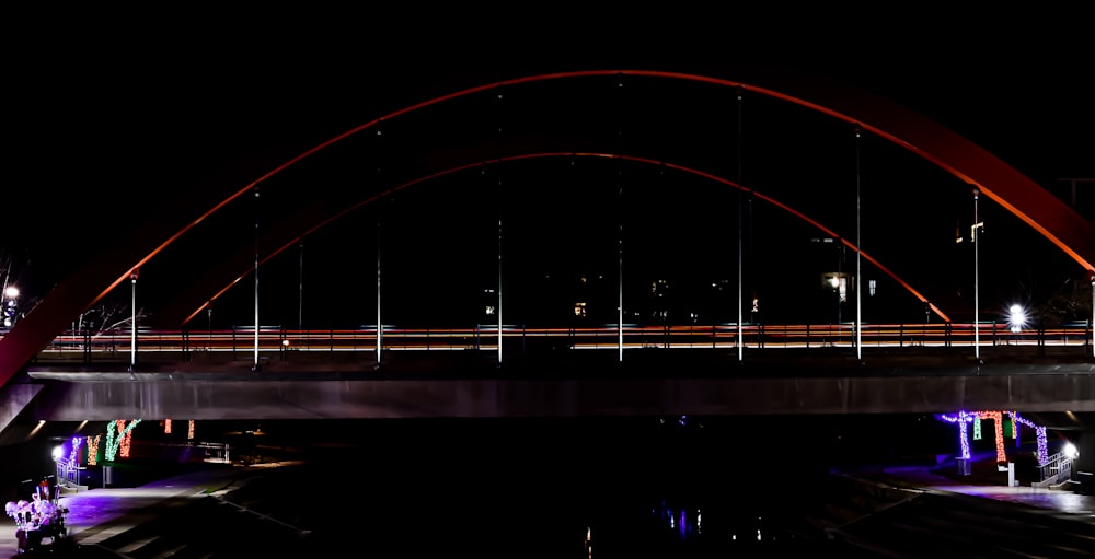 a bridge that is lit up at night
