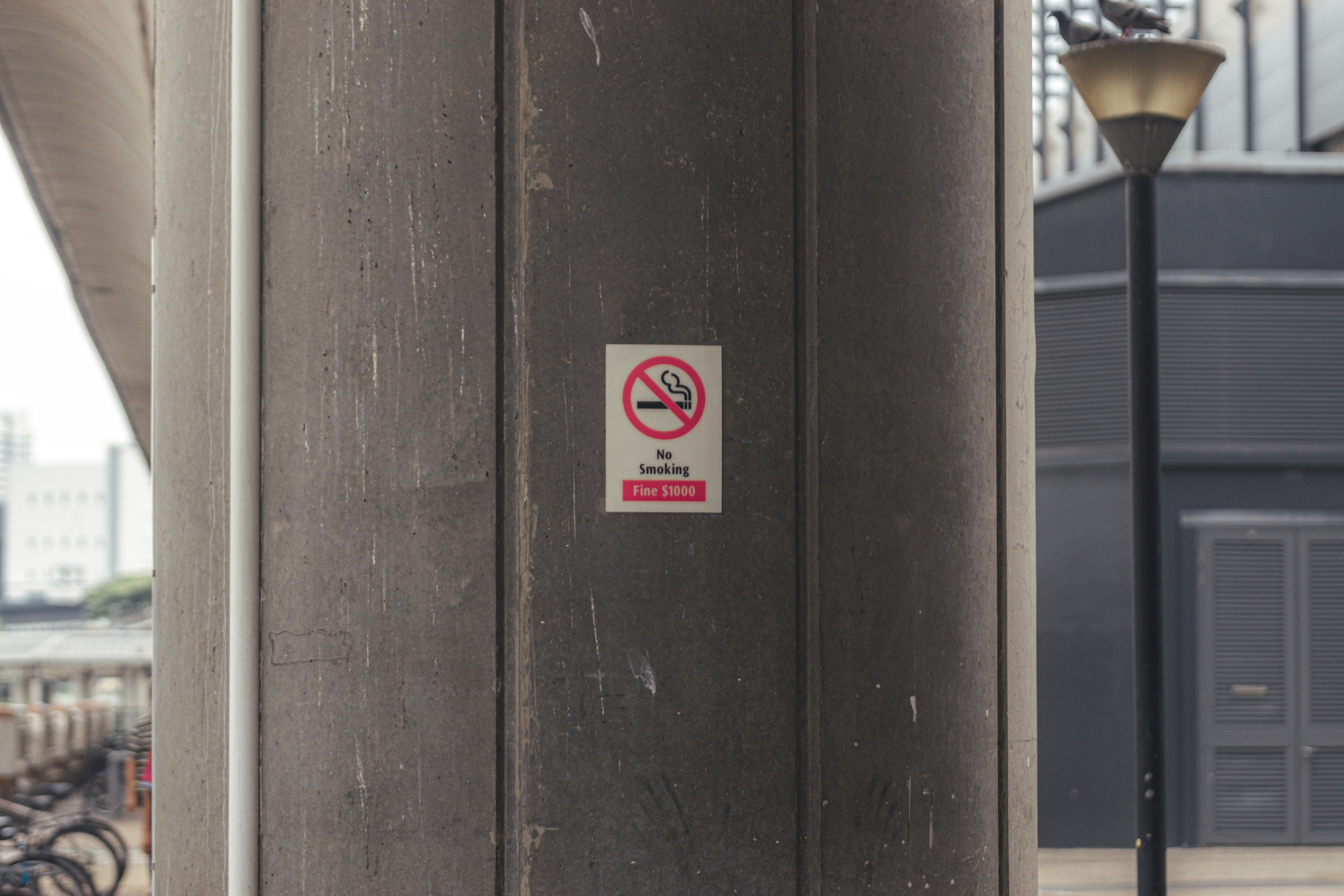 a no parking sign on the side of a building