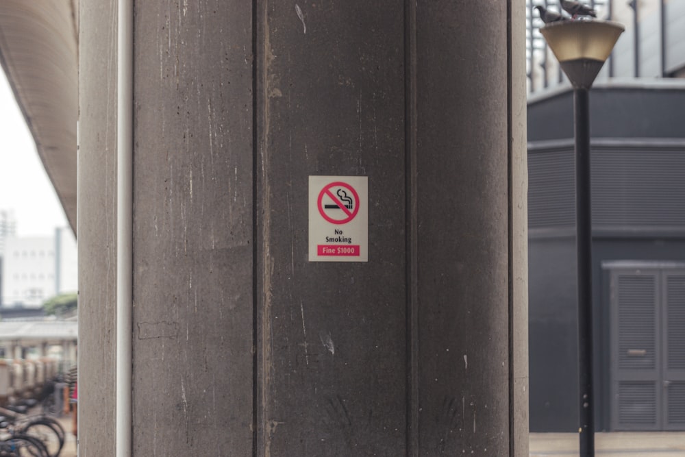 a no parking sign on the side of a building