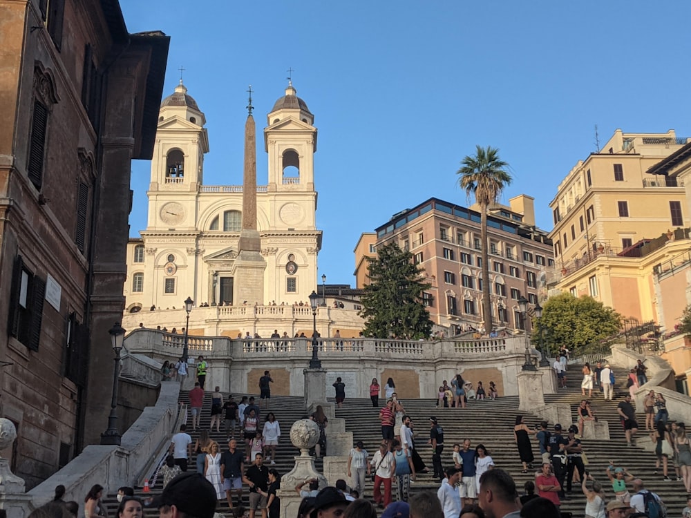 a group of people walking up and down some steps