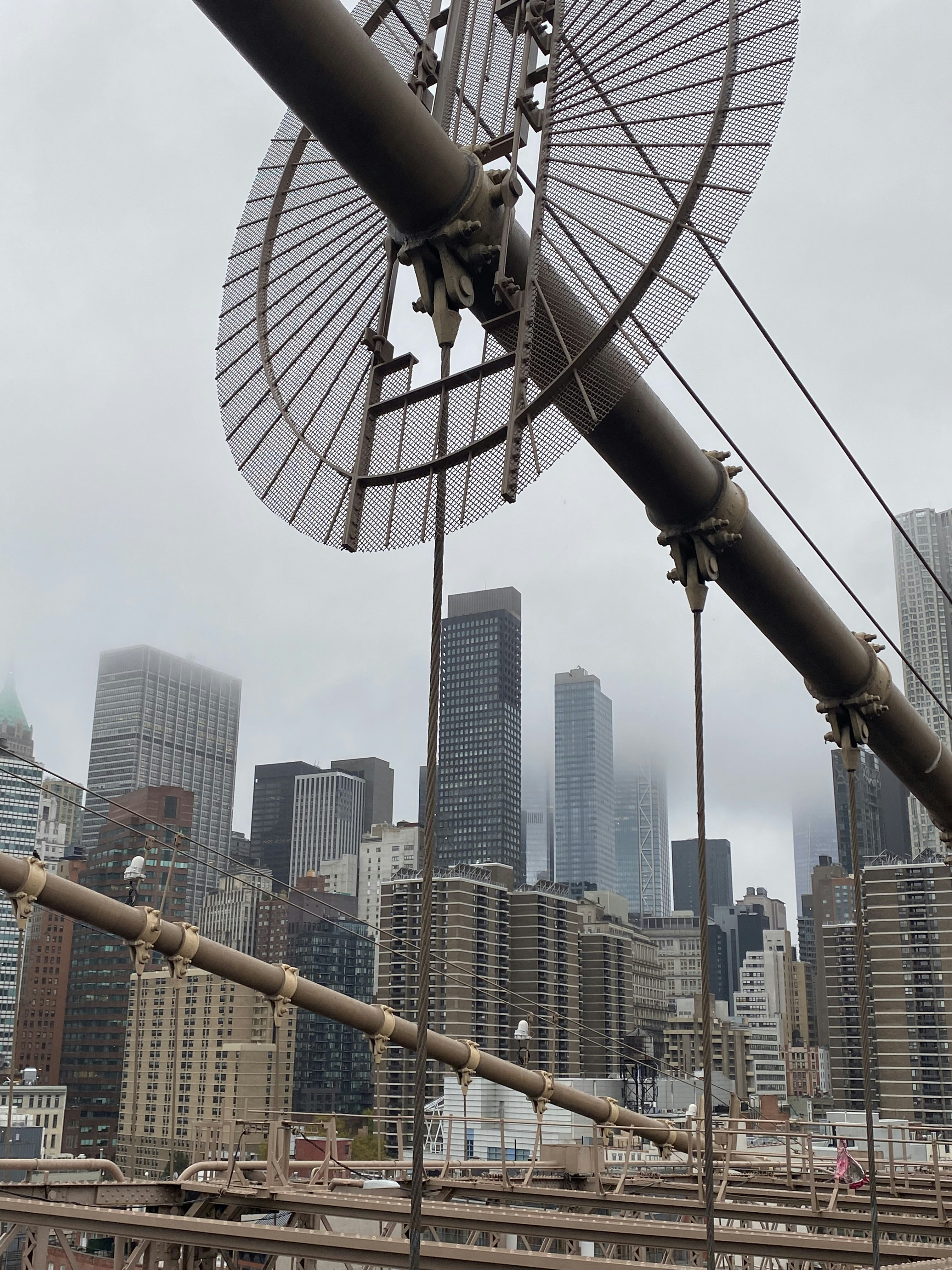 A large metal object sitting on top of a bridge photo – Free City Image ...