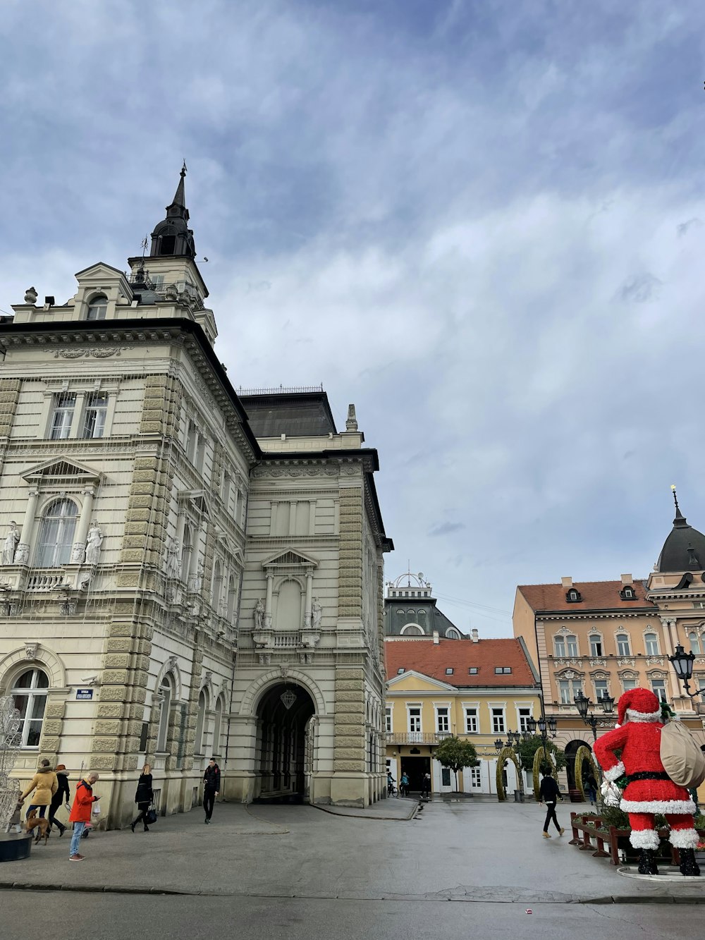 a large building with a santa clause statue in front of it