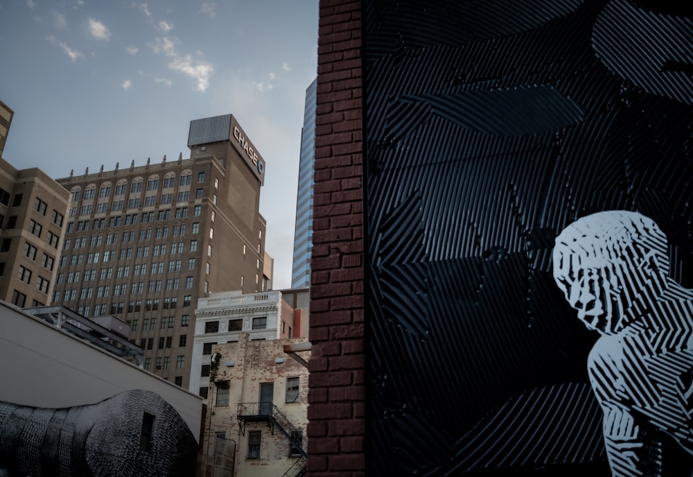 a black and white picture of a person on a building