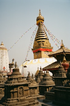 a very tall building with a lot of statues around it