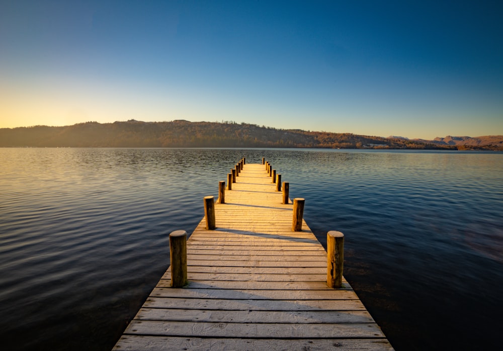a wooden dock sitting on top of a body of water
