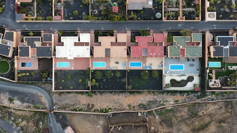 an aerial view of a street and houses