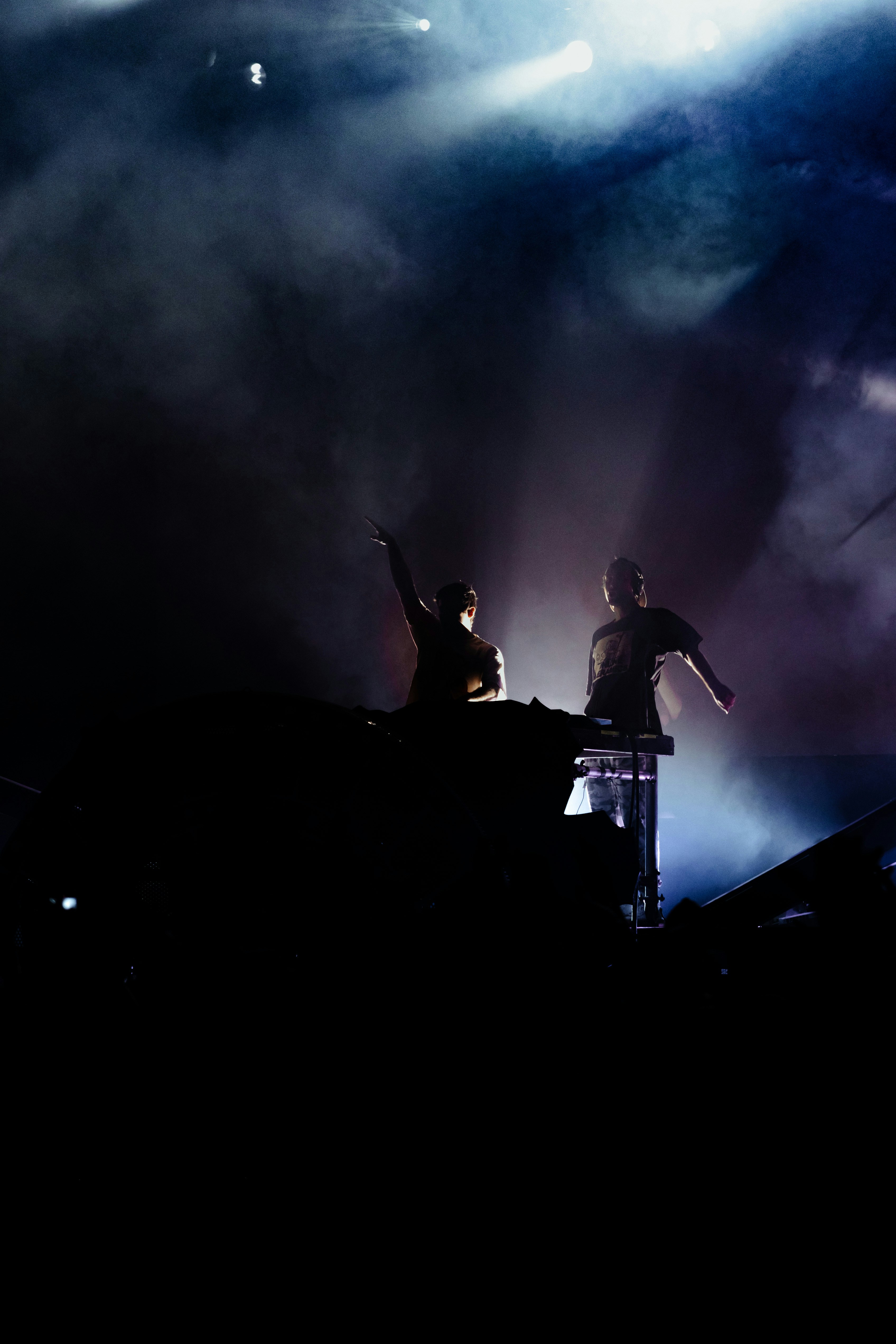 a couple of people that are standing on a stage