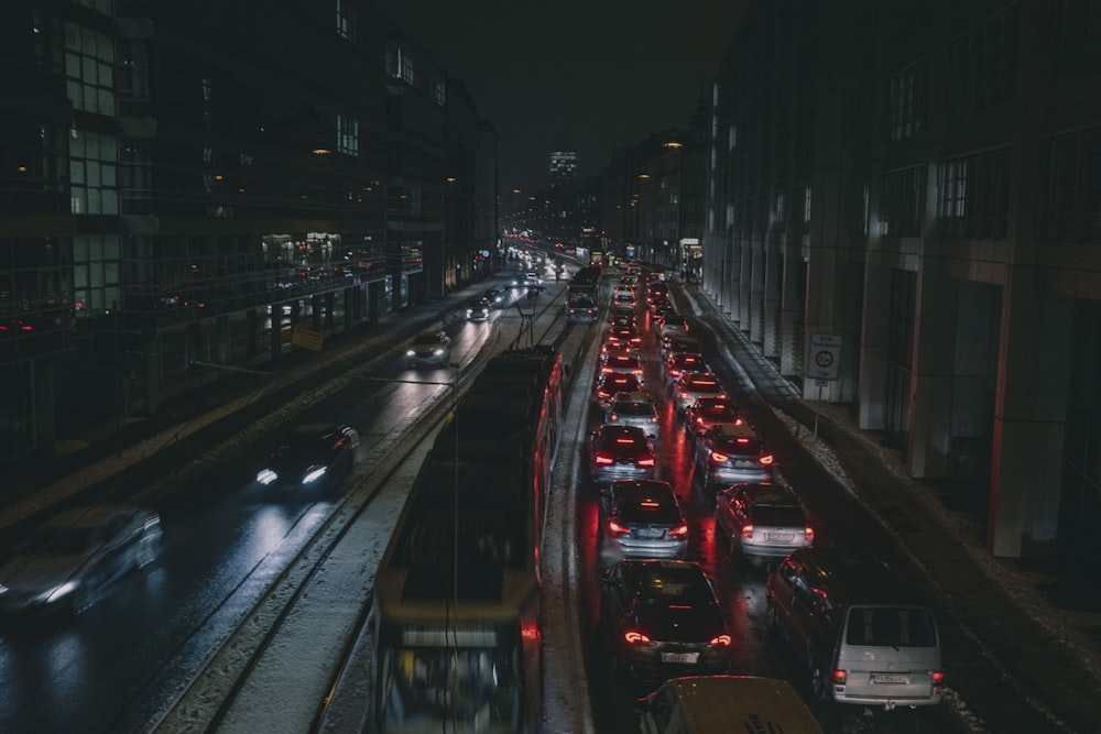 a city street filled with lots of traffic at night