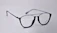 Close-up of elegant eyeglasses from the basic range with vibrant lighting highlighting their design.