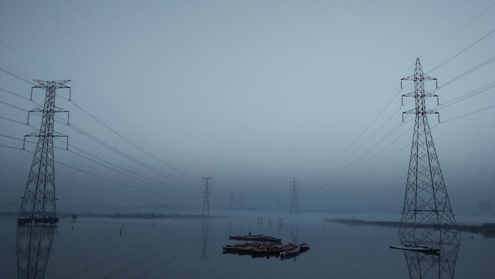 a body of water surrounded by power lines