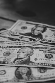 a pile of money sitting on top of a table