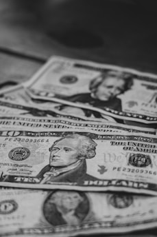 a pile of money sitting on top of a table