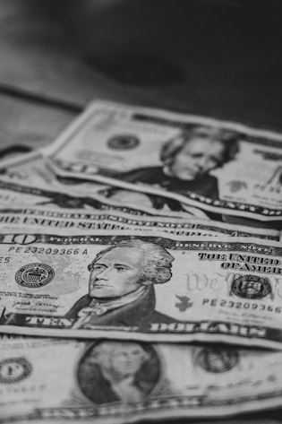 a pile of money sitting on top of a table