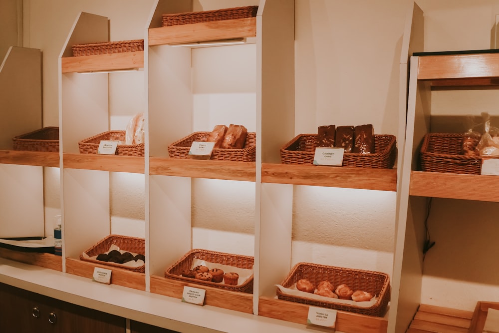 a shelf filled with lots of different types of pastries