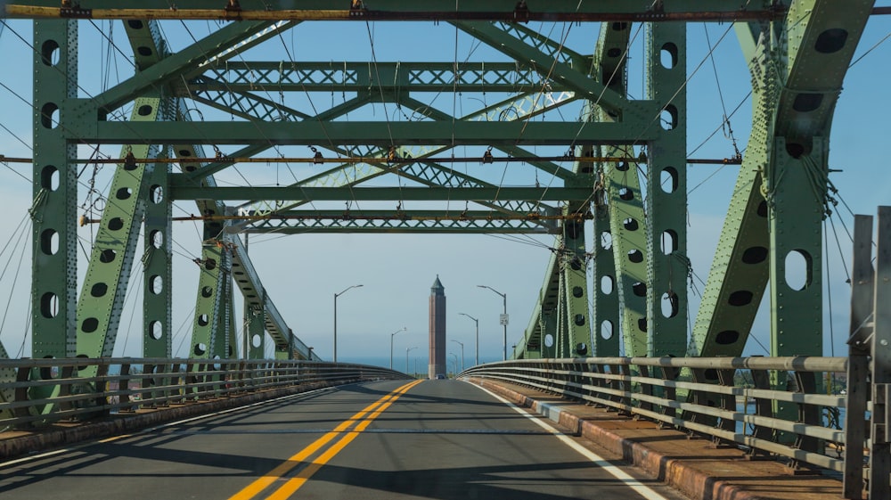 a view of a bridge with a tower in the distance