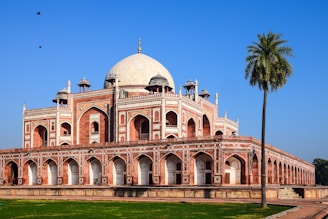 a large red brick building with a white dome