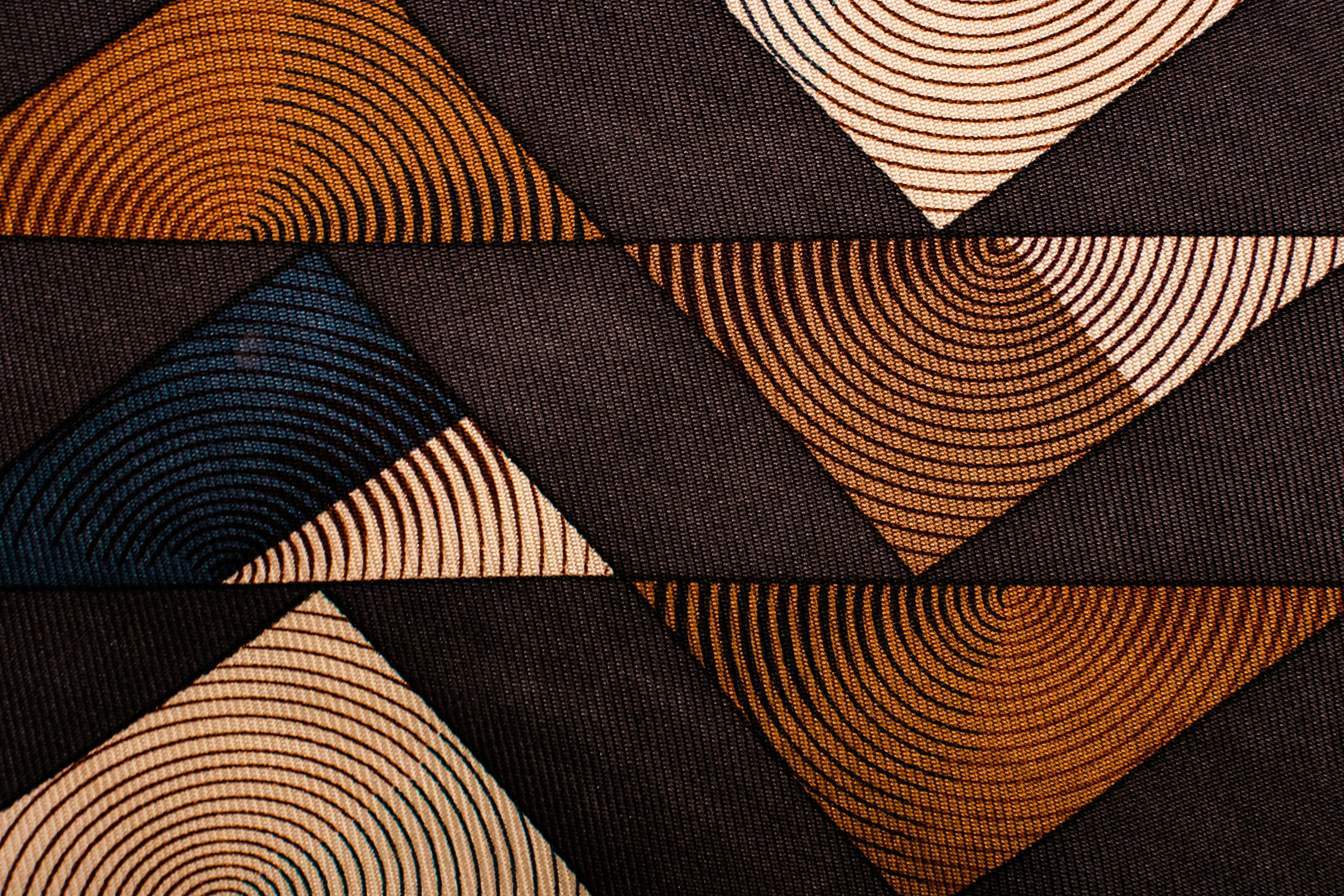 a close up of a tie with a design on it