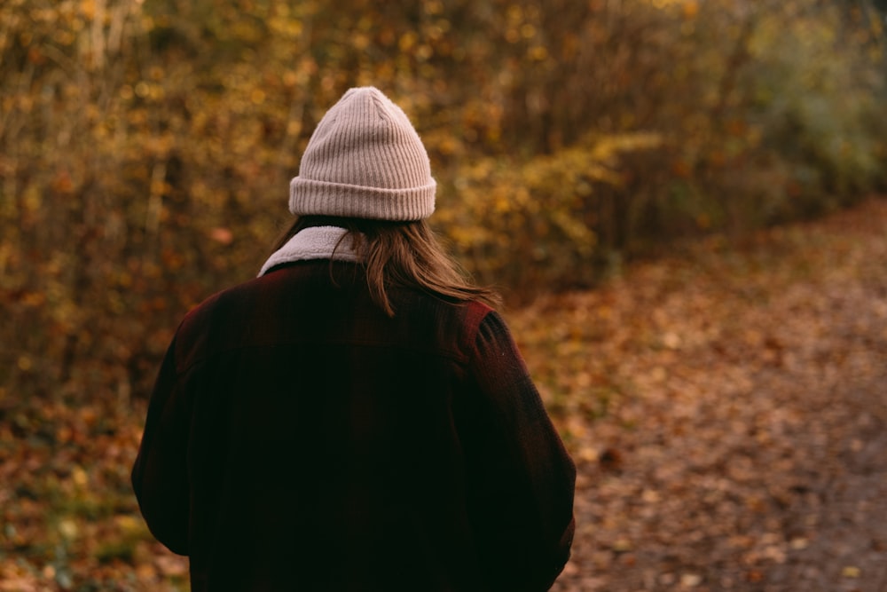 a person walking down a path in the woods