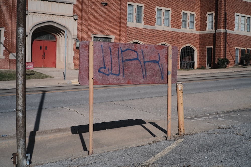 a sign that is on the side of a road