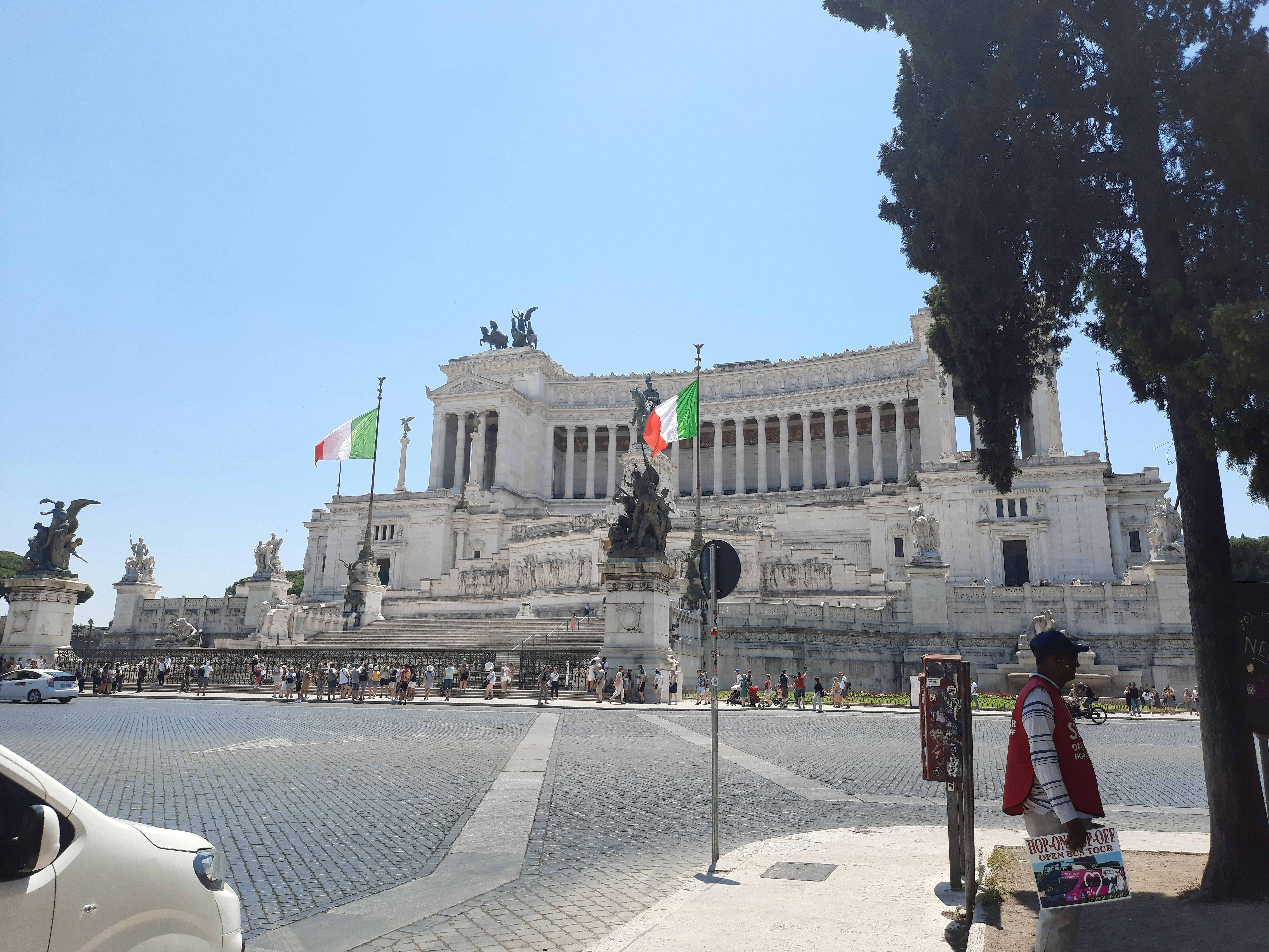 a large building with a statue in front of it