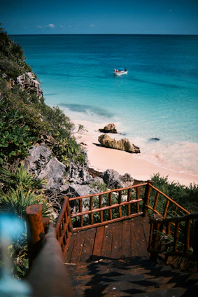 a view of a beach with a boat in the water