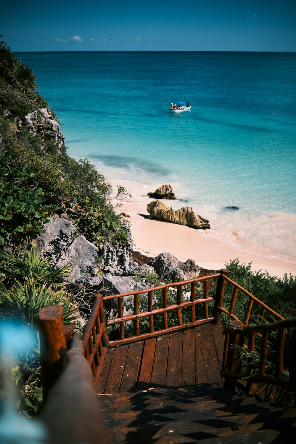 a view of a beach with a boat in the water