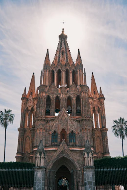 a very tall building with a cross on top of it