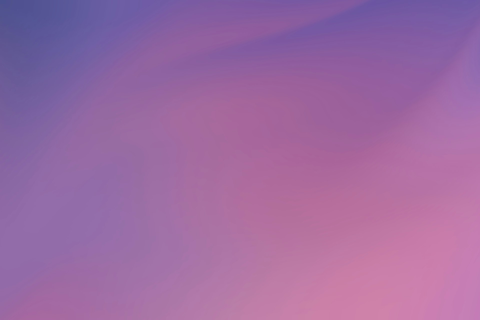 a blurry image of a purple and pink background