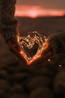 a person holding a string of lights in their hands