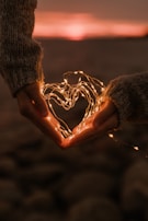 a person holding a string of lights in their hands