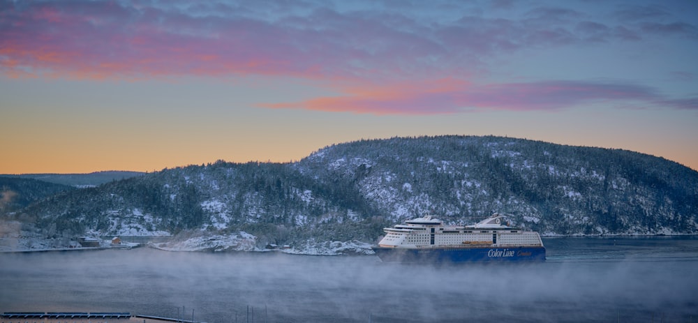 a large boat floating on top of a body of water