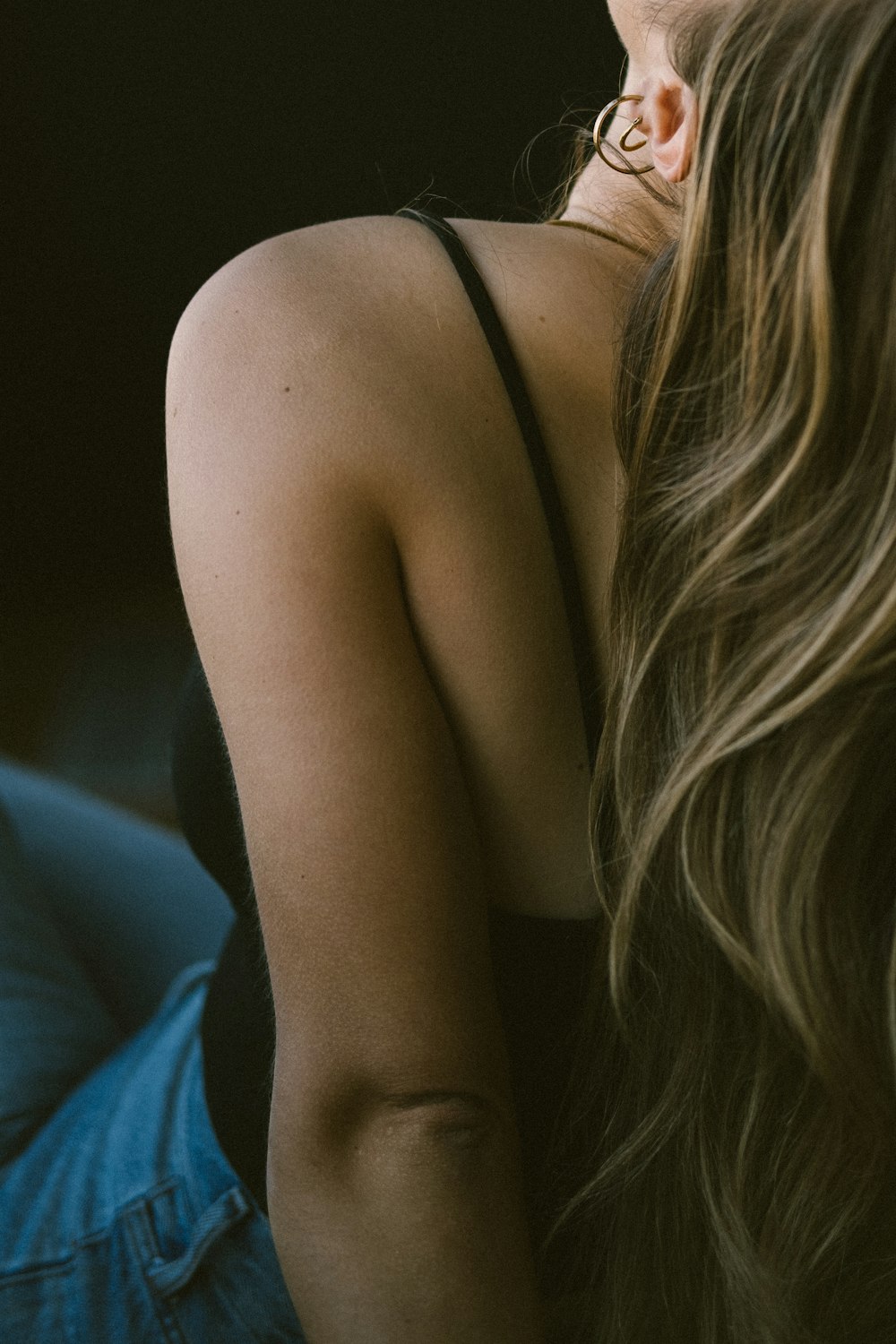 a close up of a person wearing a pair of earrings