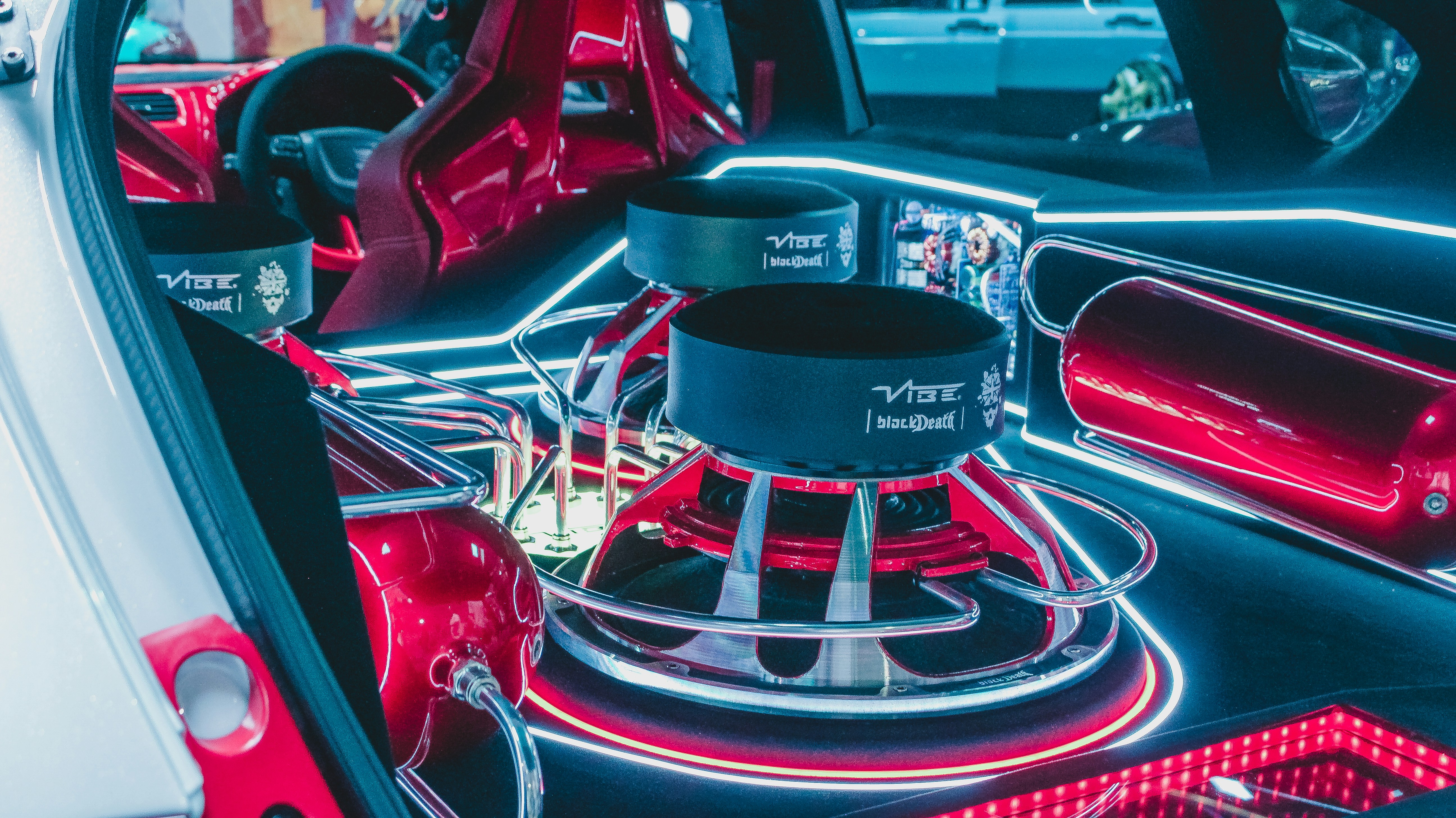 the interior of a car with red lights