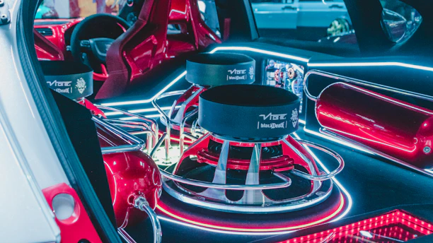 the interior of a car with red lights