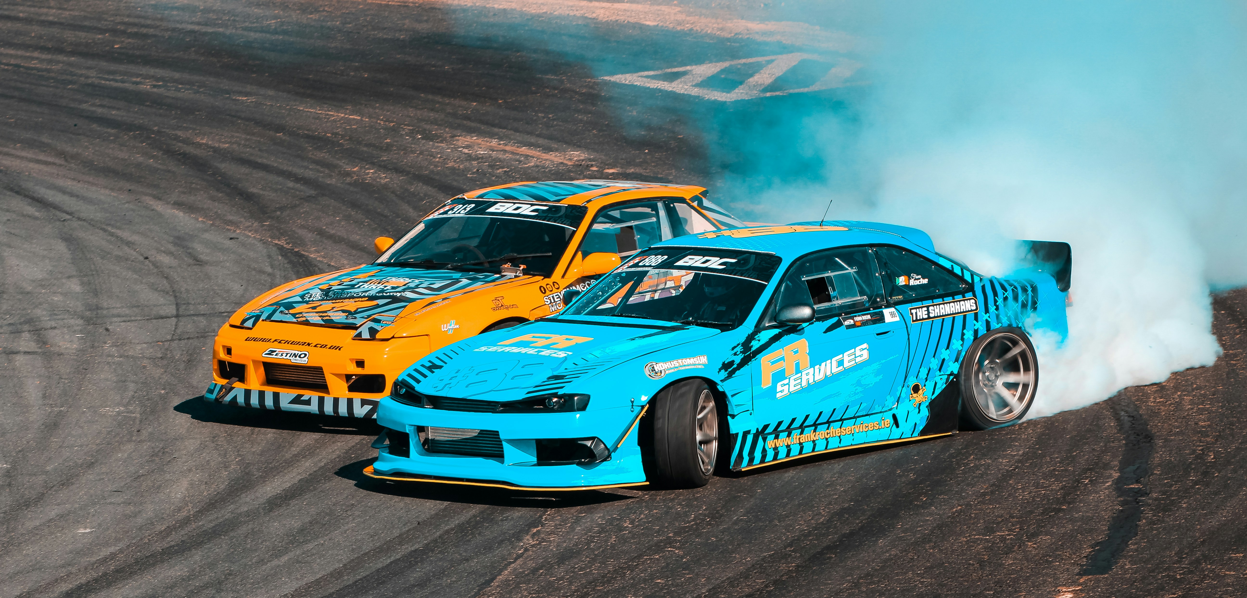 a couple of cars that are on a track