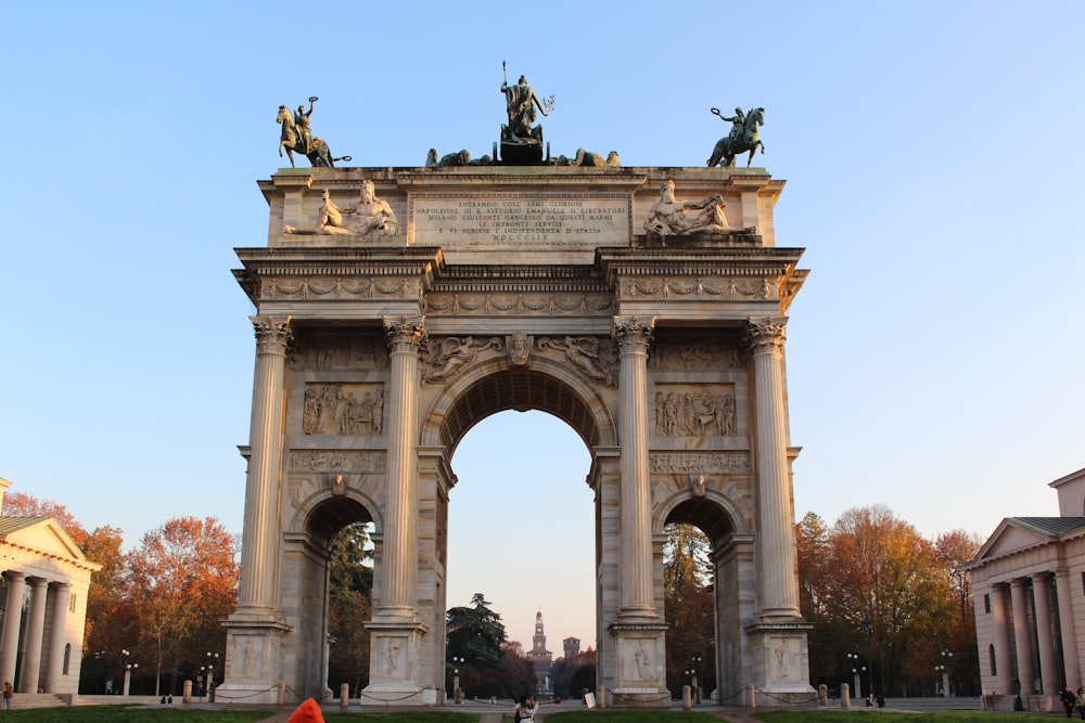 a large arch with statues on top of it