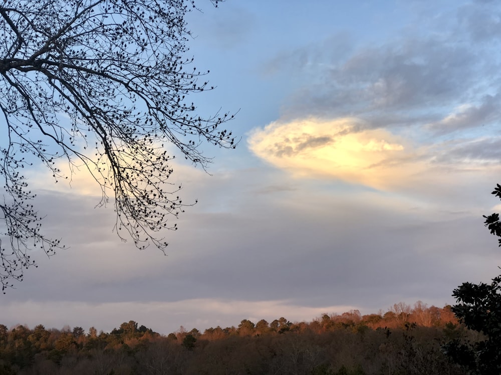 the sun is shining through the clouds in the sky