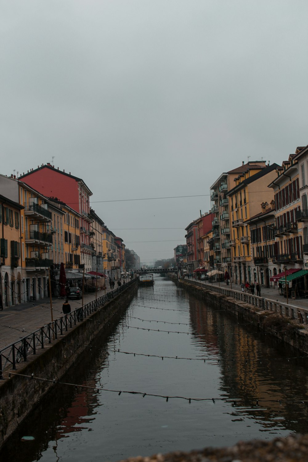 a river running through a city next to tall buildings