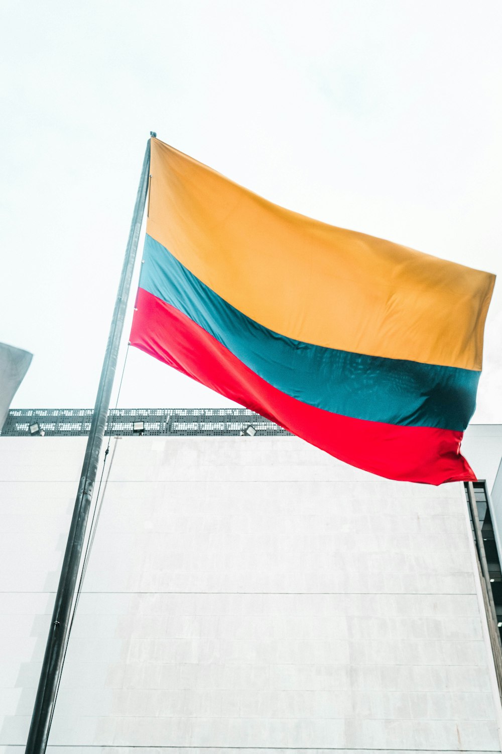 a large flag is flying in the wind