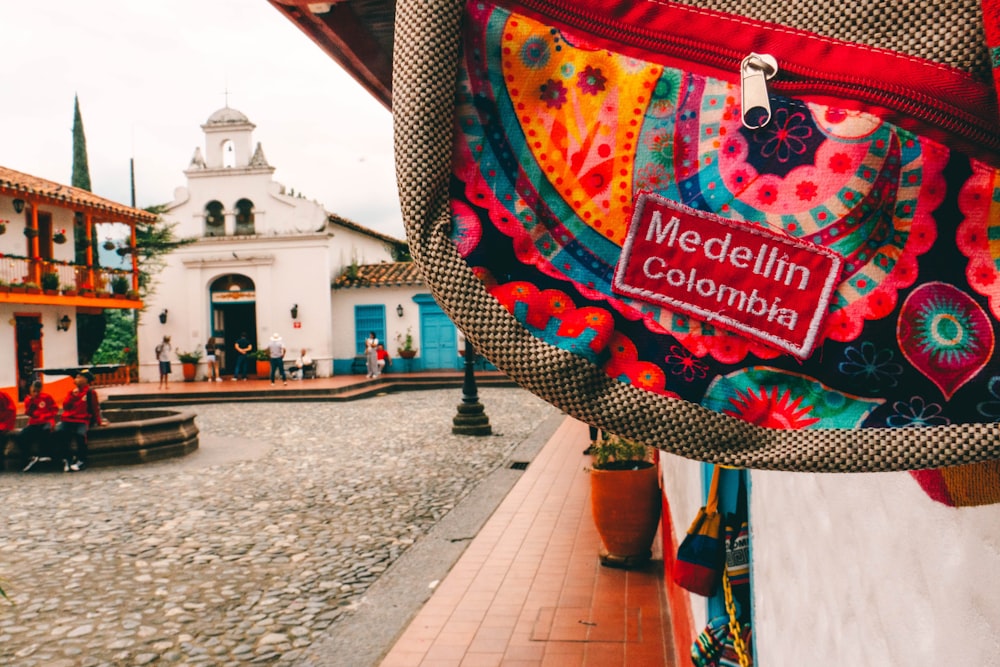 a colorful bag hanging from the side of a building