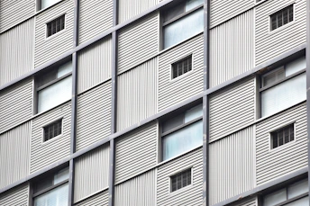 Wide shot of a building featuring a combination of metal framework and ACM panels.