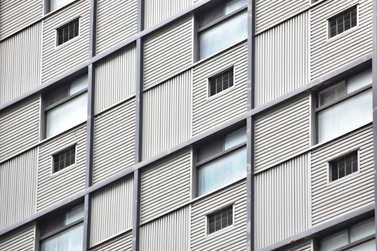 Wide shot of a building featuring a combination of metal framework and ACM panels.