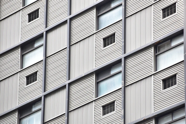 Detailed shot of vertical cladding panels with AI identifying subtle surface anomalies.