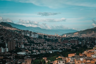 a view of a city with mountains in the background