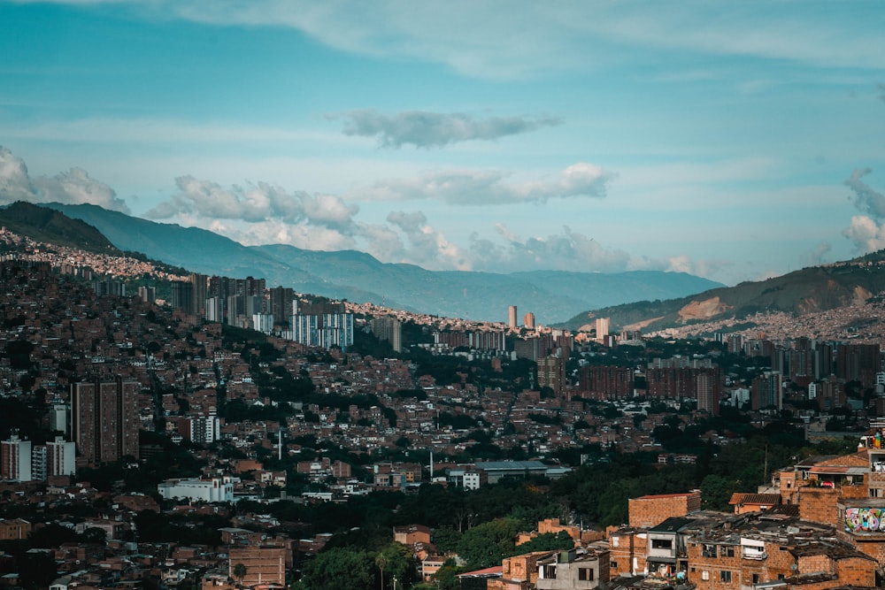 a view of a city with mountains in the background