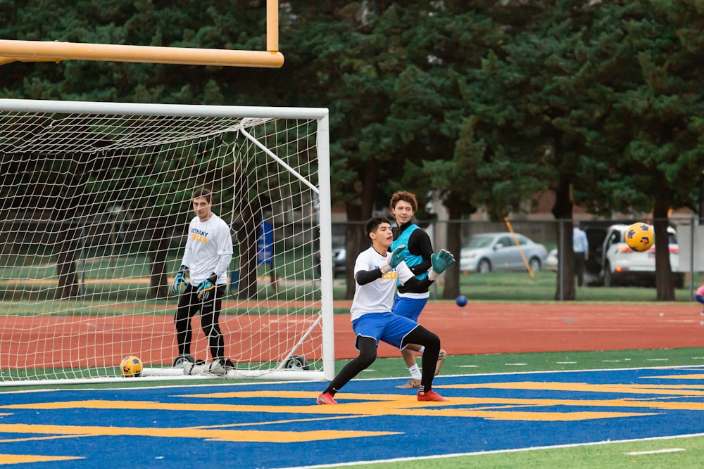 a group of young men playing a game of soccer